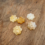 Yellow jade natural crystal flower incense holder with carved gemstone design for meditation and stick burning.