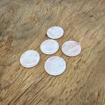 Round rose quartz flat gemstone slab, 25mm, from GemstoneGO, showcasing smooth polished pink crystal with natural stone details.
