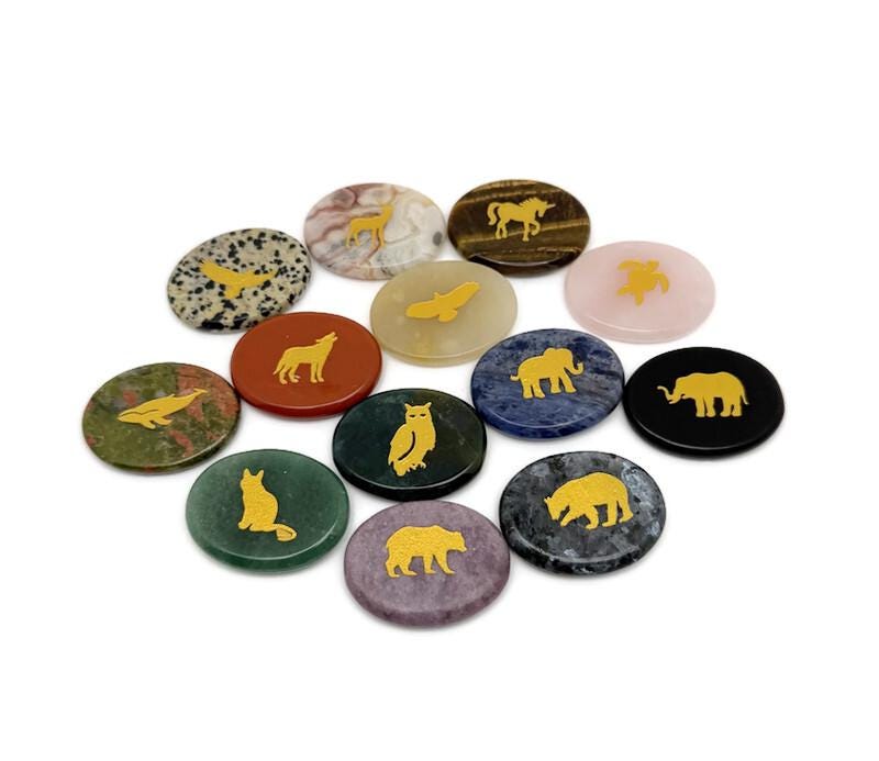 Animal engraved gold crystal totem stone featuring detailed gemstone carvings, crafted by GemstoneGO.