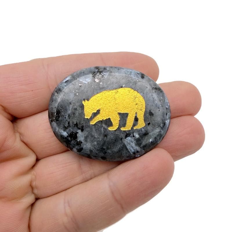 Animal engraved gold crystal totem stone by GemstoneGO, showcasing a detailed animal engraving on a clear, polished crystal surface.