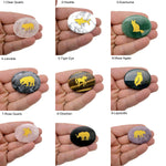 Gold crystal totem stone engraved with animal design, featuring a polished gemstone from GemstoneGO.