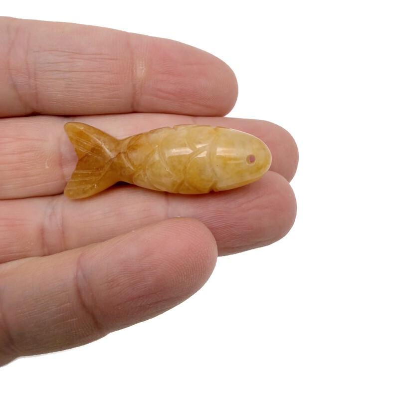 Yellow jade fish gemstone pendant from GemstoneGO, featuring a lucky fishing charm design on a silver chain.