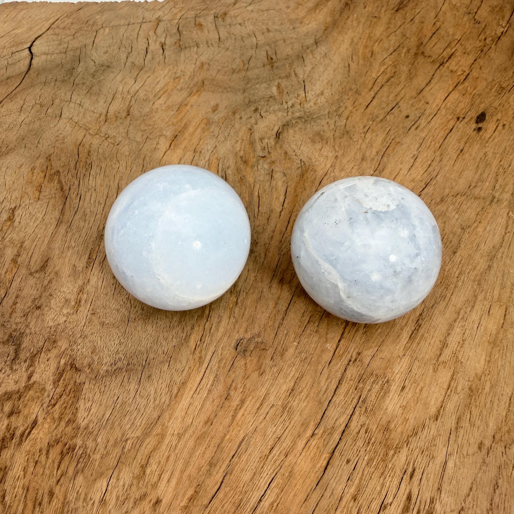 Celestite gemstone sphere, 40-50mm crystal ball from GemstoneGO, showcasing a blue and white mineral sphere with natural veining.
