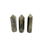 Pyrite obelisk tower crystal from GemstoneGO, showcasing a metallic gold finish and natural geometric shape on a white background.