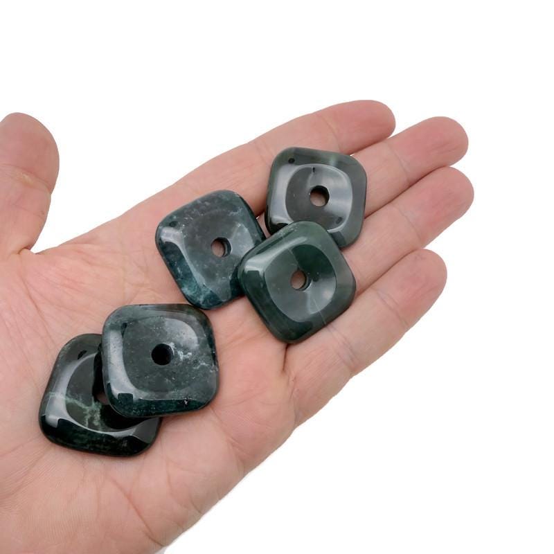 Square moss agate crystal donut from GemstoneGO, 30mm Pi stone with green and earthy patterns, polished and smooth surface.