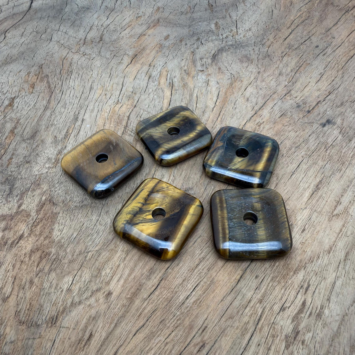 Square tiger eye crystal donut pendant with a polished 30mm Pi stone design, showcasing rich brown and golden hues.