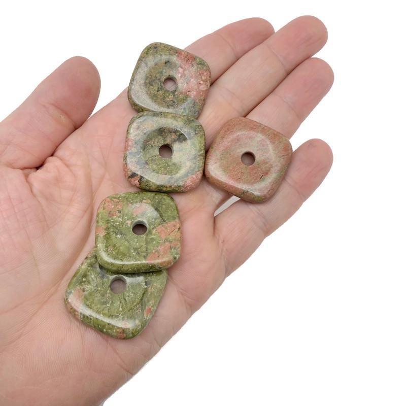 Unakite square crystal donut pendant with 30mm Pi stone from GemstoneGO, showing green and pink stone with a polished surface.