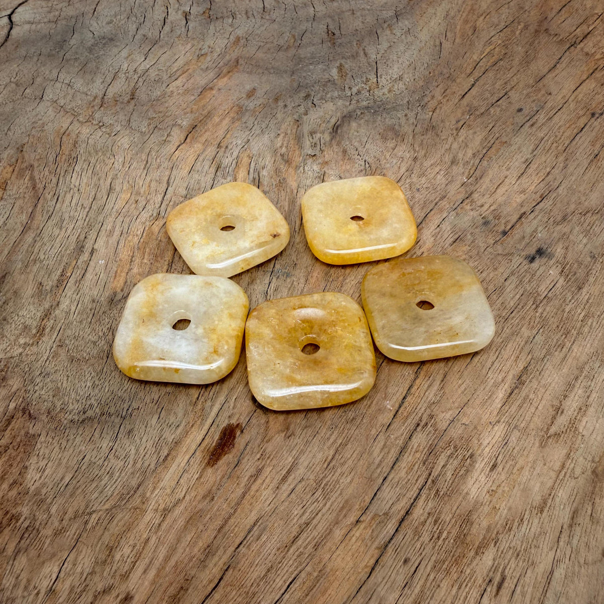 Yellow Jade square crystal donut from GemstoneGO, 30mm Pi Stone with vibrant yellow color and polished square shape.