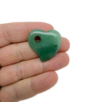 A 30mm Aventurine crystal heart with a hole, showcasing green gemstone with natural patterns, used for jewelry or decoration.