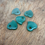A 30mm Aventurine crystal heart with a hole, showcasing vibrant green gemstone with natural inclusions and smooth polished surface.
