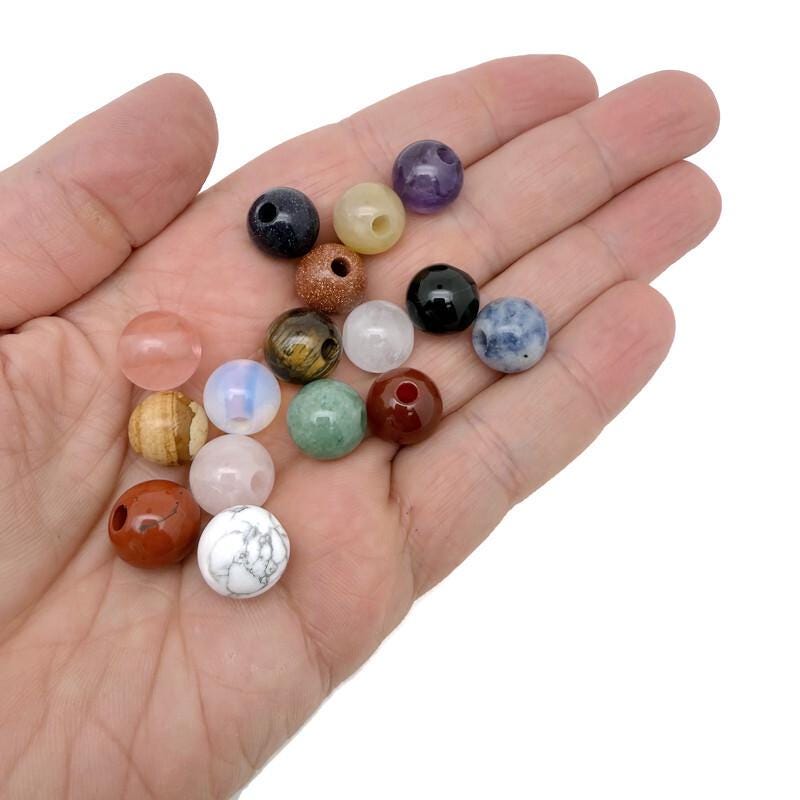 Round crystal beads from GemstoneGO, 12mm DIY jewelry making gemstone pack with mixed clear and iridescent colors.