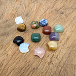 Assorted 16mm crystal moon beads from GemstoneGO for jewelry making, showcasing shiny, translucent moon-shaped gemstone beads.