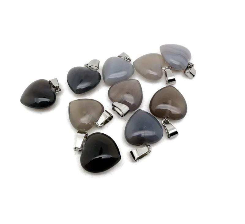 Grey agate heart pendant from GemstoneGO featuring a mini crystal design, showcasing a smooth, polished gemstone pendant.