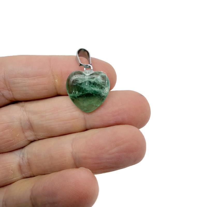 Mini fluorite heart pendant from GemstoneGO, showcasing a colorful crystal gemstone with a silver bail for jewelry making.