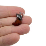 Mahogany Obsidian moon-shaped crystal pendant from GemstoneGO, ideal for jewelry making and crafting accessories.