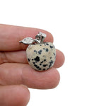 Dalmatian Jasper Apple crystal pendant from GemstoneGO, featuring a mini gemstone pendant with black and beige spotted pattern.