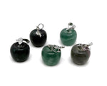 Mini fluorite apple crystal pendant from GemstoneGO, featuring a vibrant green and purple gemstone carved into an apple shape.