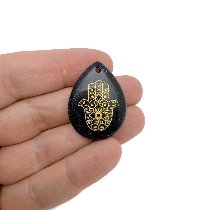 Engraved Hamsa Hand crystal pendant with drilled hole, symbolizing protection, luck, and spiritual energy from GemstoneGO.