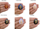 Engraved Hamsa Hand crystal from GemstoneGO with drilled hole, symbolizing protection, luck, and spiritual energy.