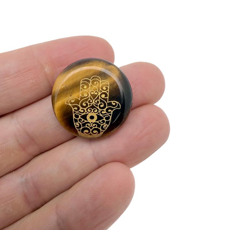 Engraved Hamsa Hand crystal pendant with intricate designs, symbolizing protection, luck, and spiritual energy, by GemstoneGO.