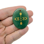 Drilled crystal amulet engraved with cosmic energy symbol, representing universe alignment, by GemstoneGO.