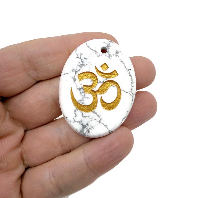 Crystal amulet featuring engraved Om symbol from GemstoneGO, drilled for spiritual insight and guidance.