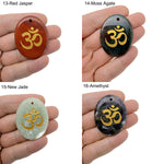 Crystal amulet with engraved Om symbol, drilled for jewelry, representing spiritual insight and guidance from GemstoneGO.