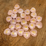 Personalized rose quartz engraved crystal letter heart from GemstoneGO, featuring a carved initial on a polished pink crystal heart.