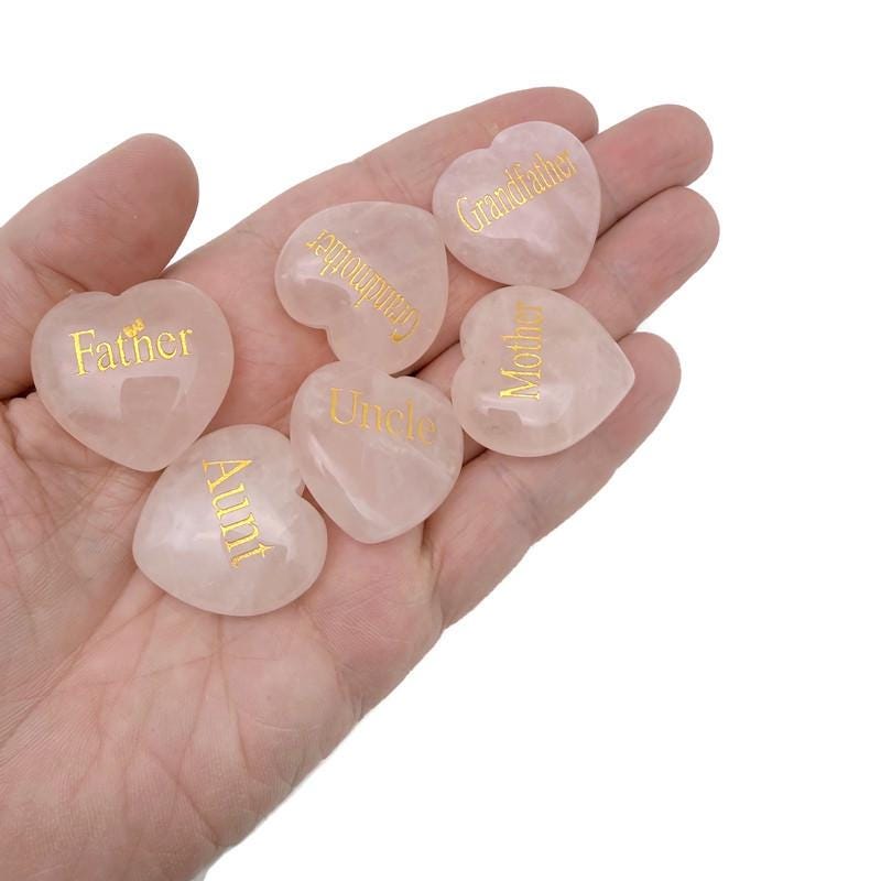 Rose quartz engraved crystal family heart from GemstoneGO, featuring a polished healing crystal with engraved family design.