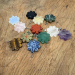 Snowflake gemstone pendant with healing stones from GemstoneGO, featuring a delicate design and mixed gemstone colors.
