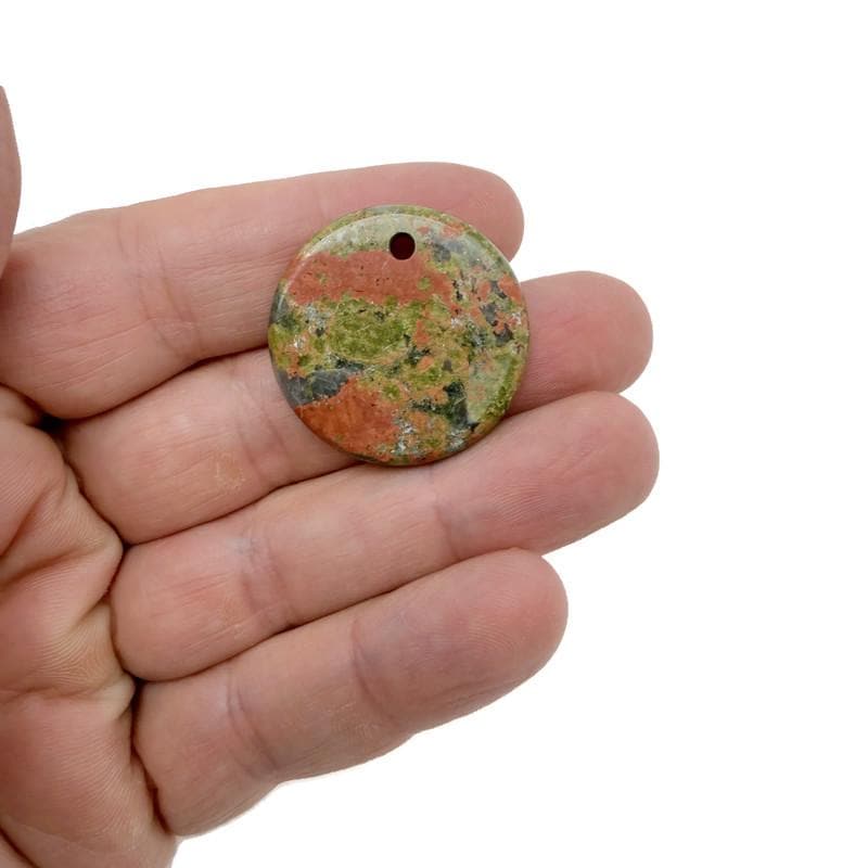 Round gemstone pendant featuring a drilled natural crystal disc charm, showcasing vibrant colors and polished surface by GemstoneGO.