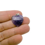Faceted heart-shaped natural crystal pendant from GemstoneGO, showcasing a sparkling clear gemstone charm.