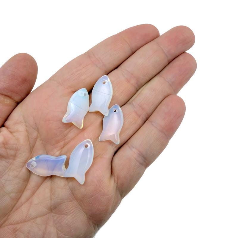 Opalite fish-shaped crystal pendant featuring a healing stone charm, perfect for jewelry and spiritual healing.