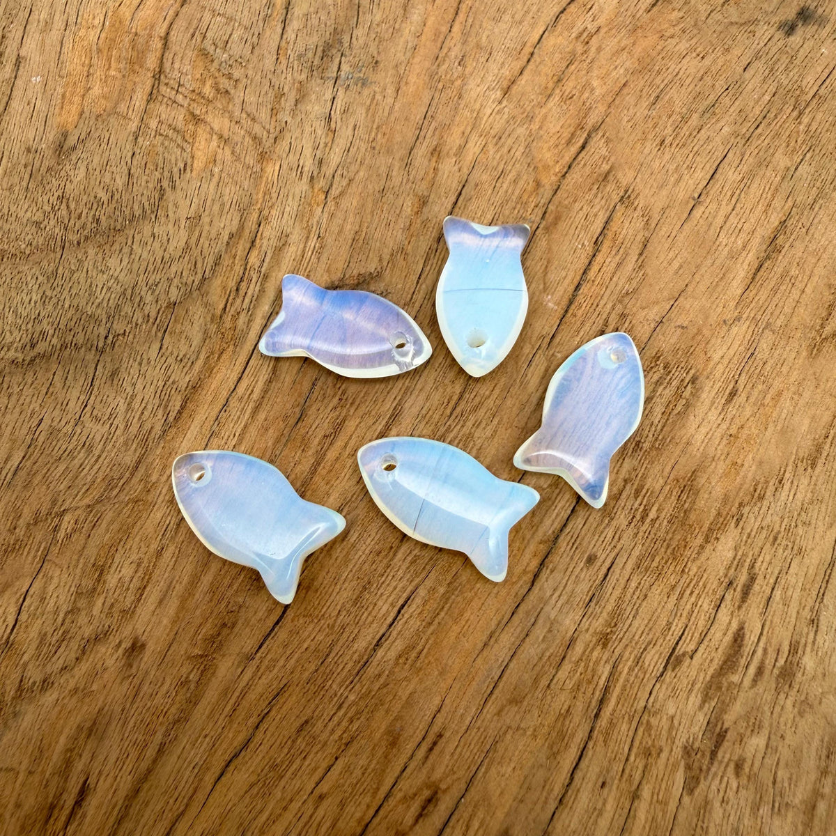 Opalite fish-shaped crystal pendant with gemstone charm, featuring a healing stone design for jewelry.