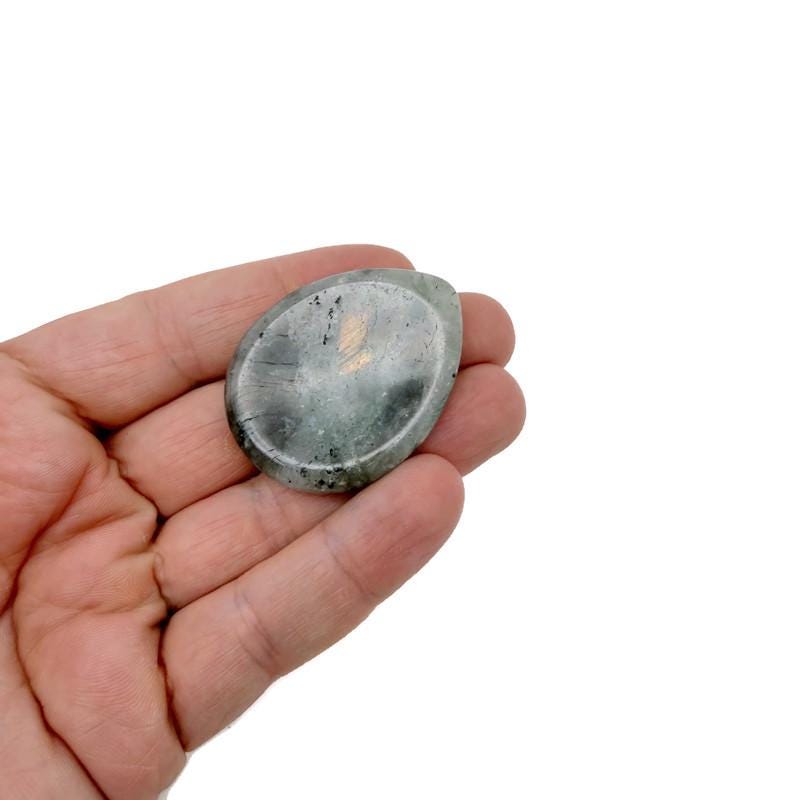 Labradorite worry stone from GemstoneGO, 45mm soothing crystal with iridescent flashes, hand-polished for calming grip and meditation.