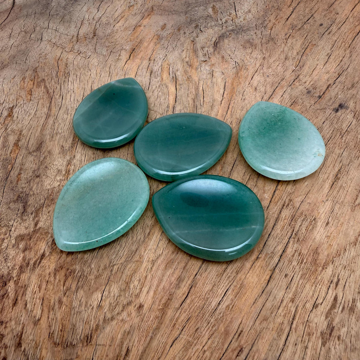 Aventurine worry stone, smooth 45mm crystal from GemstoneGO, used for calming and stress relief, with polished surface and natural green color.