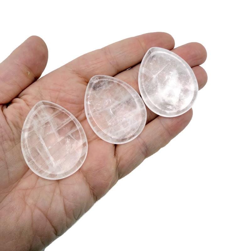 Clear quartz worry stone from GemstoneGO, 45mm smooth crystal with polished surface for calming and meditation use.