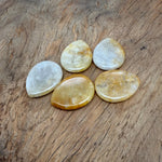 Yellow jade worry stone from GemstoneGO, 45mm soothing crystal with smooth polished surface for stress relief.