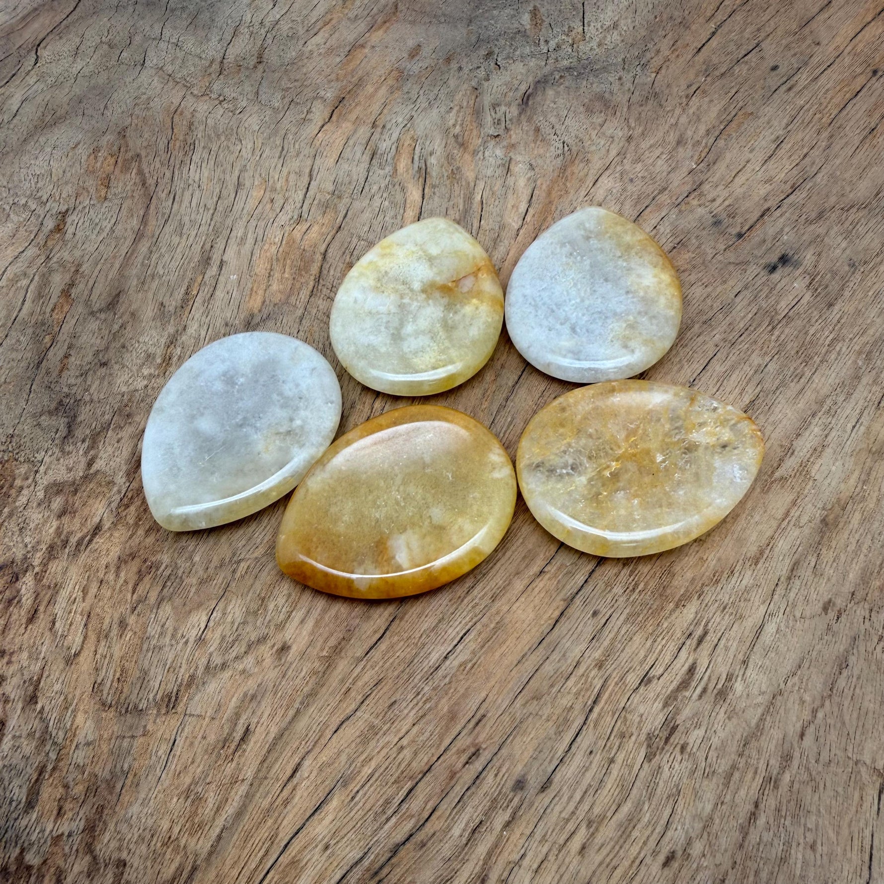 Yellow jade worry stone from GemstoneGO, 45mm soothing crystal with smooth polished surface for stress relief.