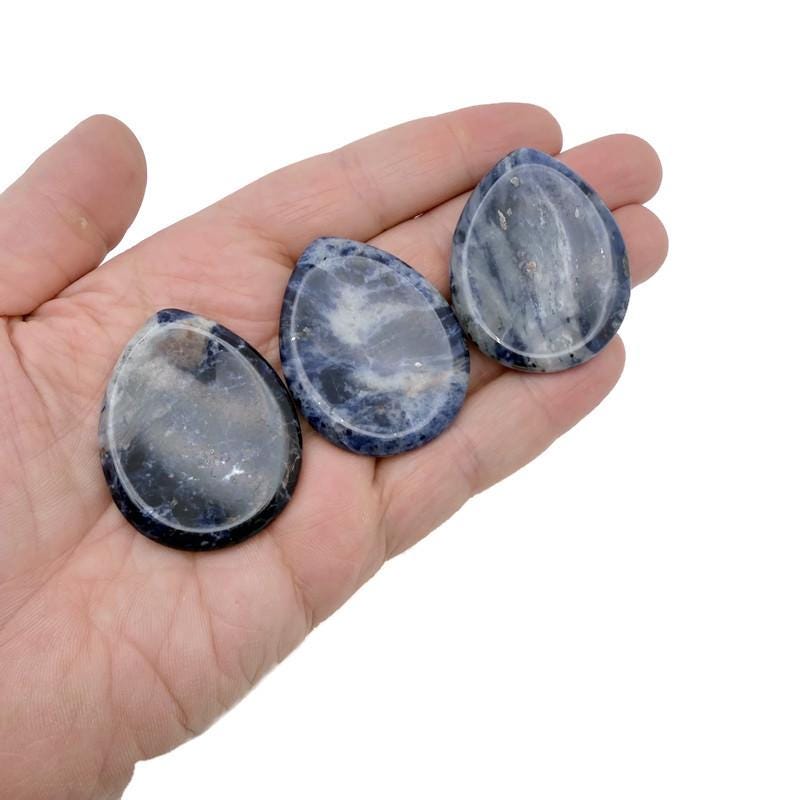 Sodalite worry stone from GemstoneGO, 45mm soothing crystal with polished blue and white mineral patterns for stress relief.