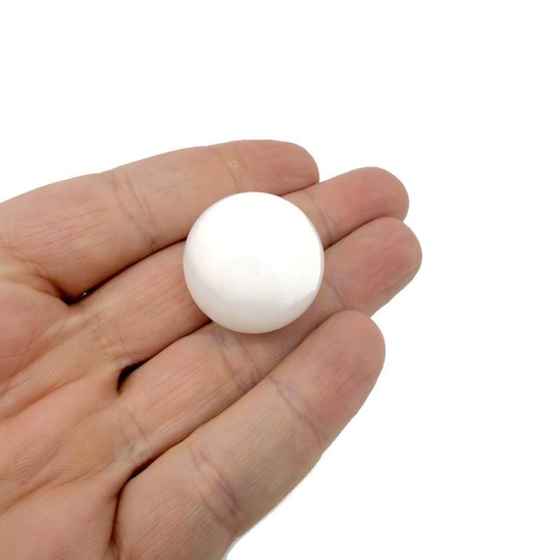 25mm natural crystal sphere from GemstoneGO, showcasing a clear, polished gemstone ball with a smooth, rounded surface.