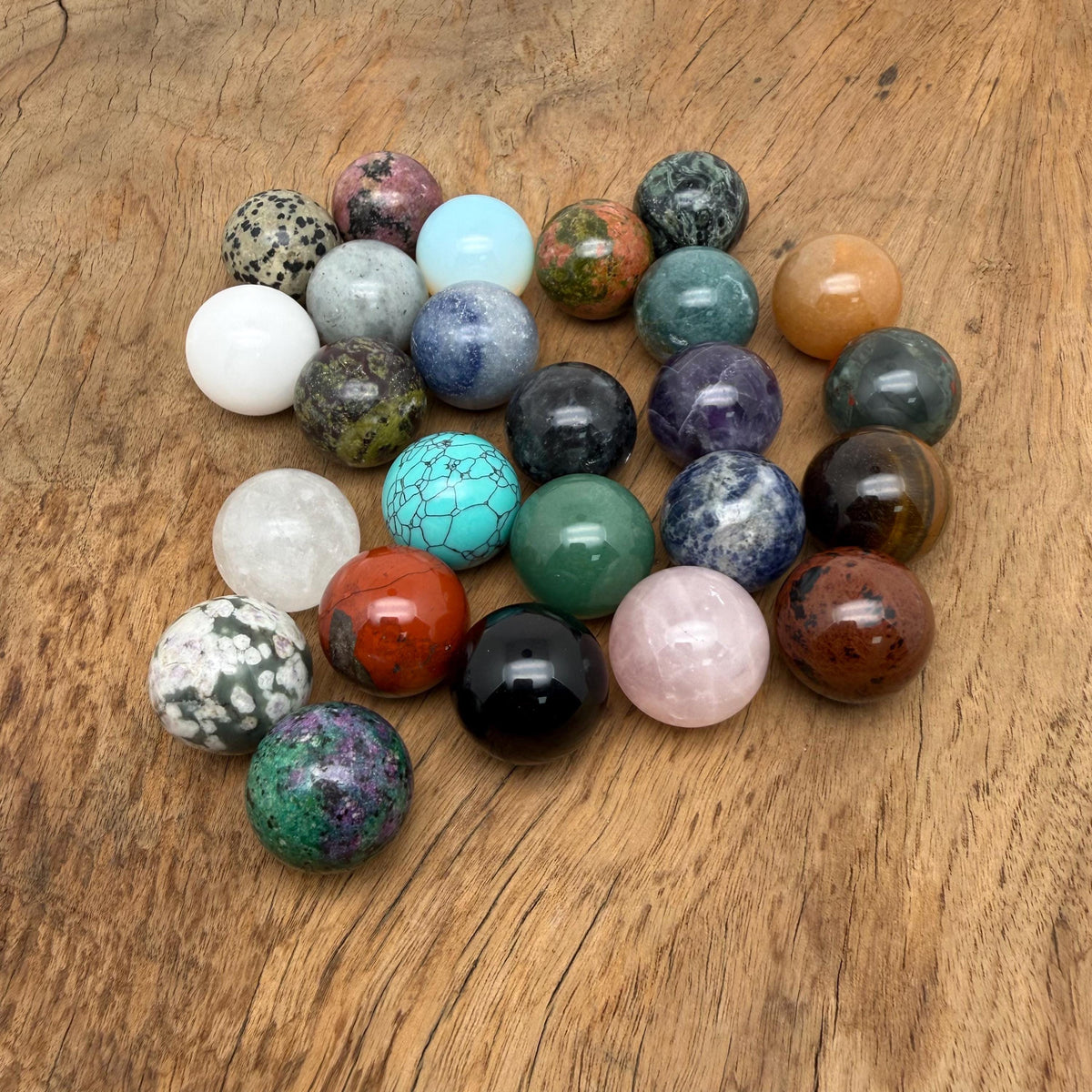 25mm natural crystal sphere from GemstoneGO, showcasing a clear, polished gemstone ball with subtle natural stone variations.