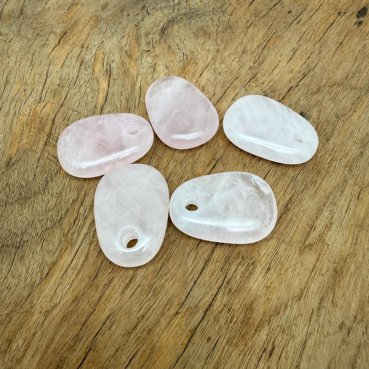 Rose quartz oval crystal pendant from GemstoneGO, natural stone jewelry making bead with smooth polished surface.