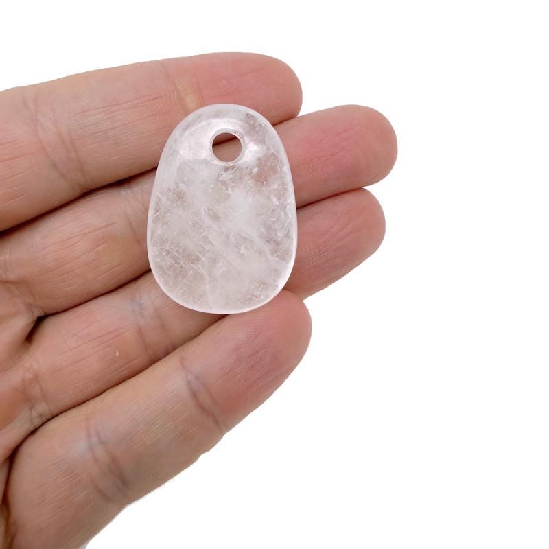 Oval clear quartz crystal pendant from GemstoneGO, showcasing a polished natural stone bead for jewelry making.