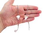 Healing crystal pendulum with stainless steel chain from GemstoneGO, featuring a clear gemstone and intricate detailing.
