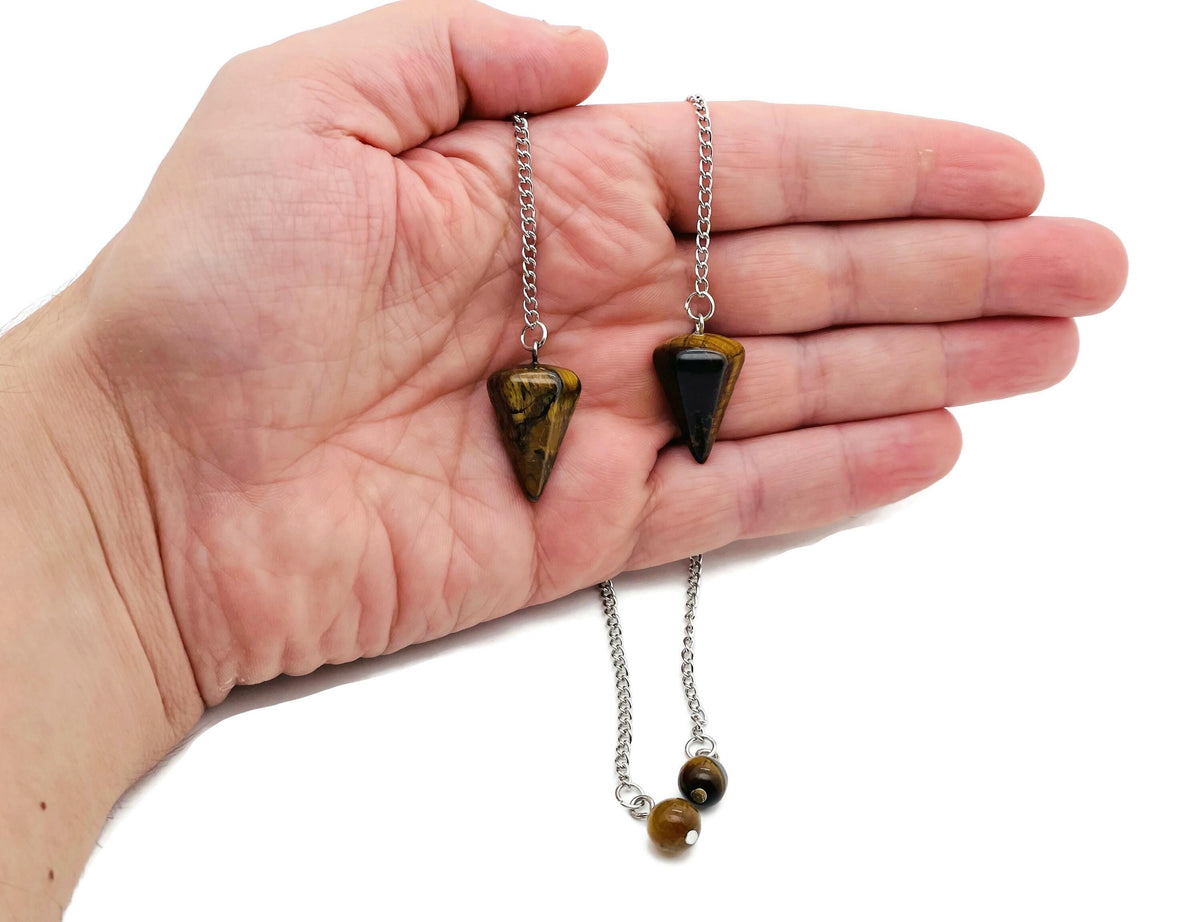 Healing crystal pendulum with stainless steel chain from GemstoneGO, featuring a polished gemstone and a sleek metal chain.