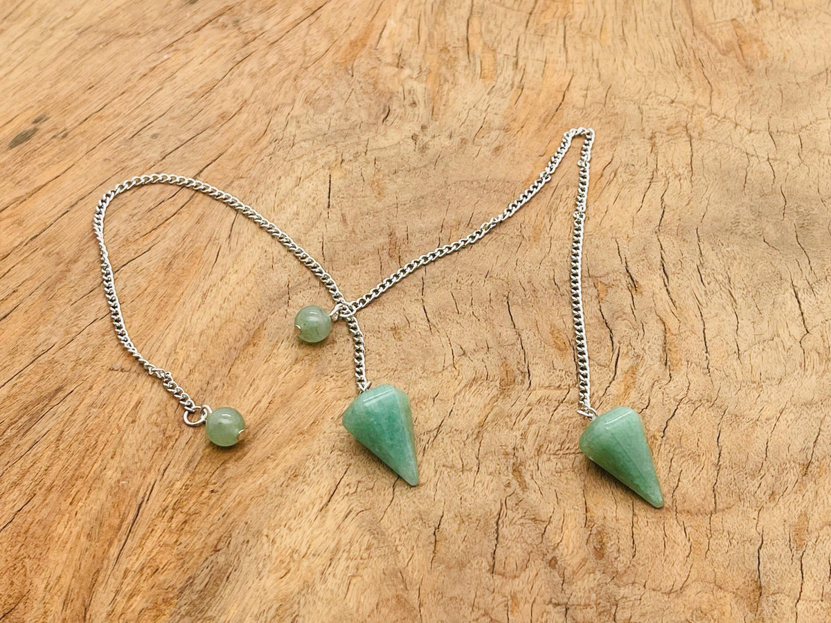 Aventurine crystal pendulum with stainless steel chain, gemstoneGO, showcasing a green aventurine gemstone hanging from a sleek metal chain.