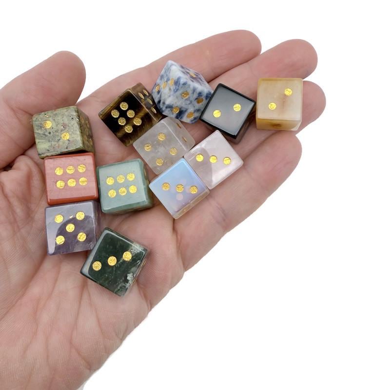 Polished gemstone crystal dice set by GemstoneGO, featuring carved multi-colored dice for metaphysical use and gaming.