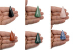 Carved gemstone cone ring holder from GemstoneGO, a jewelry display stand for showcasing rings on a natural stone cone.