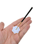 Hand-carved gemstone flower incense holder with a small bowl for stick incense, ideal for meditation and relaxation.